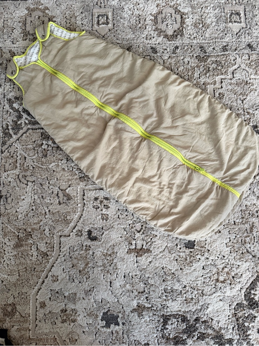 Beige Sleep Sack with lime green trim.